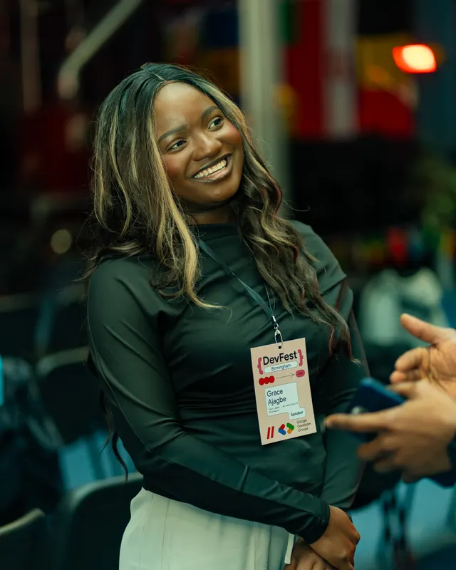 A smiling guest chatting during a conference