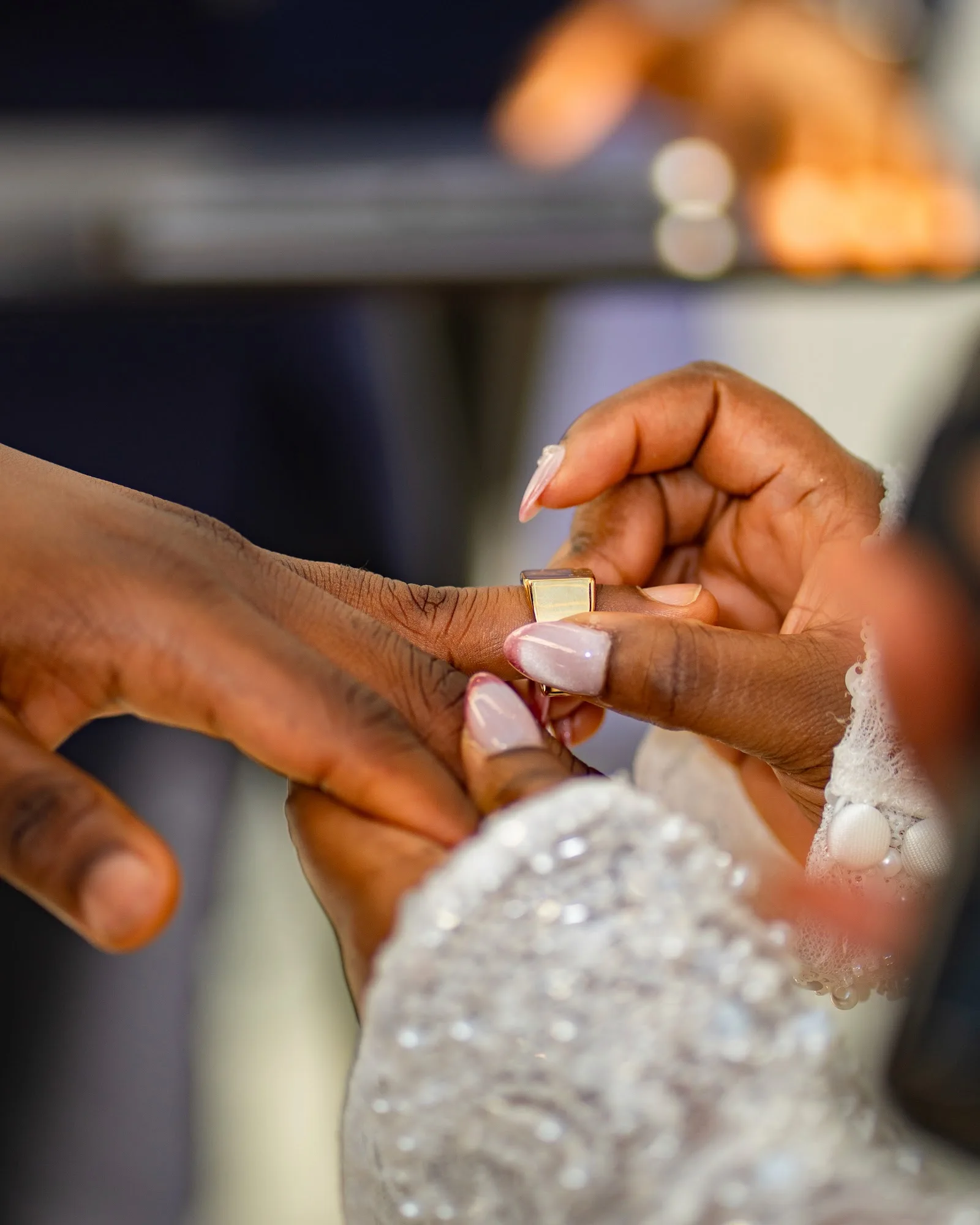 A close-up of the wedding ring exchange