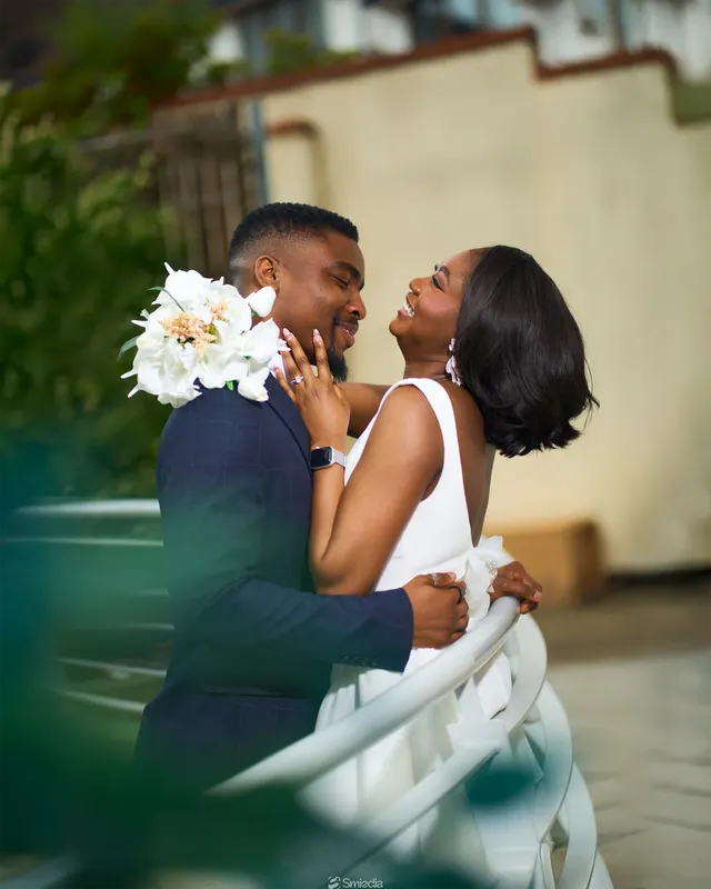 Newlyweds embracing outdoors