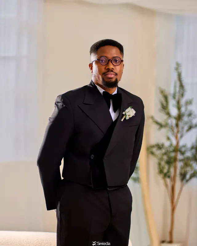 A groom in a black tuxedo