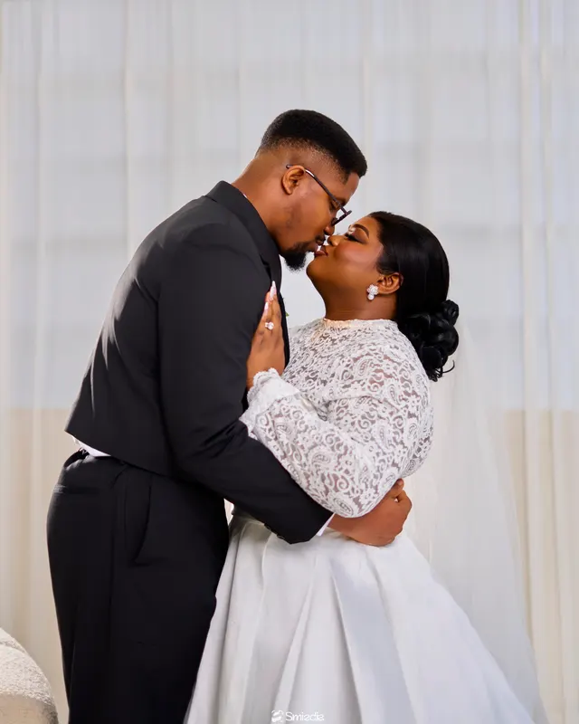 Precious and Paul sharing a kiss